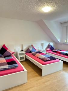 a room with two beds in a room at Holiday Apartment Adenau in Adenau