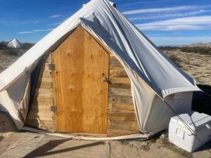 a tent in the middle of the desert at New Yurt City in Lake Los Angeles