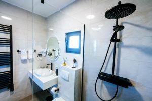 a bathroom with a shower and a sink at Dedaj Resort - Villa Delux in Zadar