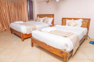Postel nebo postele na pokoji v ubytování Paleo Hotel and Spa, Thika