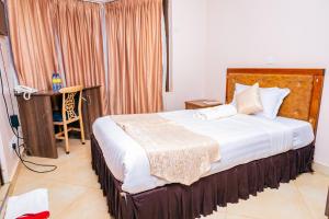 Postel nebo postele na pokoji v ubytování Paleo Hotel and Spa, Thika