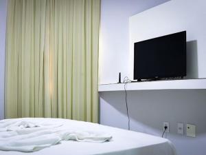 Et tv og/eller underholdning på Elegance flat Natal RN - PLAC