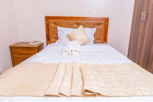 Postel nebo postele na pokoji v ubytování Paleo Hotel and Spa, Thika