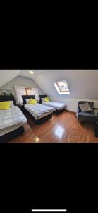 a room with three beds in a room at Woodland lodge, apartment in Derry Londonderry