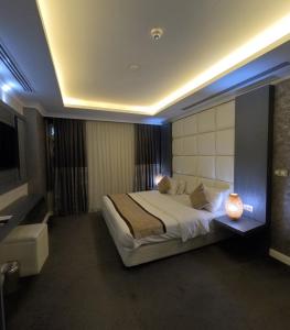 Säng eller sängar i ett rum på Mariana Hotel Erbil