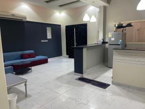 a room with a kitchen and a living room at شليه in Hafr Al Baten