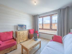 a room with a bed and a couch and a table at Appartement 2 pièces dans une nouvelle résidence de standing - FR-1-645-56 in LʼHuez