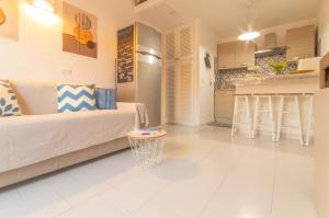 a living room with a couch and a table at Casa Michela in Palau