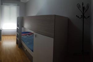 a bunk bed in a room with a window at Apartamento con terraza 2 hab. in Alcalá la Real