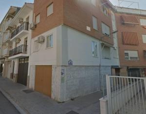 a building on the side of a street at Apartamento con terraza 2 hab. in Alcalá la Real