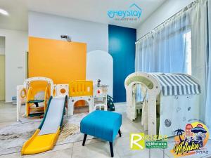 a childrens play room with colorful play equipment at Atlantis Residences Melaka by HeyStay Management(2) in Melaka