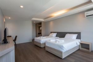 Postel nebo postele na pokoji v ubytování Tisha Hotel