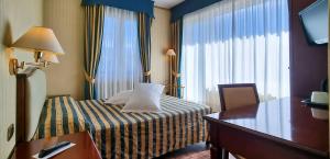 Postel nebo postele na pokoji v ubytování Hotel Benaco Garda ***S