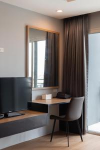 TV a/nebo společenská místnost v ubytování Tisha Hotel