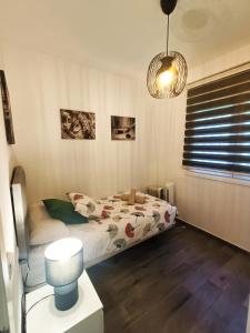 Łóżko lub łóżka w pokoju w obiekcie BEACH&GARDEN