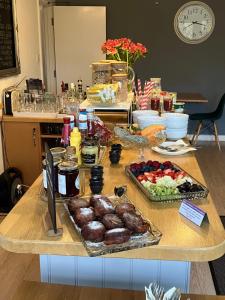 a table with a bunch of food on it at The Coast Yard in Selsey