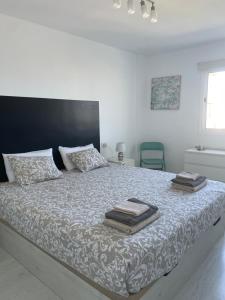 A bed or beds in a room at Las Americas Ocean View El Dorado