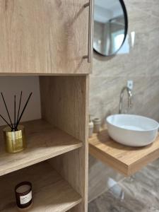 a bathroom with a sink and a mirror at Terra Solis Bihać Villa 1 in Bihać +20 photos