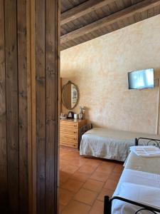 Postel nebo postele na pokoji v ubytování Il Podere degli Asinelli + 35 fotografií