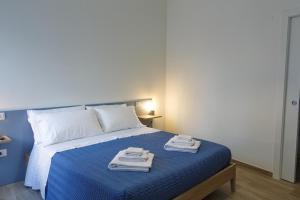 Postel nebo postele na pokoji v ubytování Fresia B&B