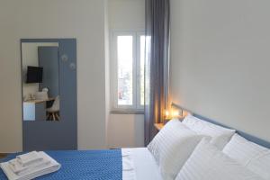 Postel nebo postele na pokoji v ubytování Fresia B&B