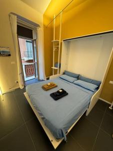 Postel nebo postele na pokoji v ubytování Vicolo Muratori 1