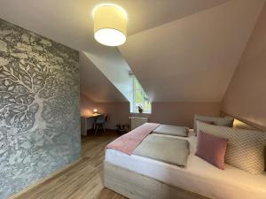 Letto o letti in una camera di Apartmány penzion Jasmín