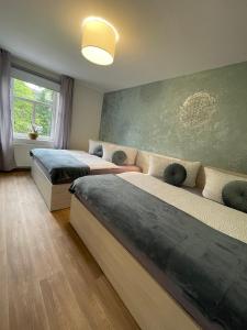 Letto o letti in una camera di Apartmány penzion Jasmín