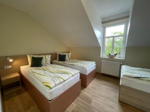 Letto o letti in una camera di Apartmány penzion Jasmín