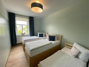 Letto o letti in una camera di Apartmány penzion Jasmín