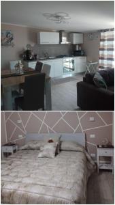 Altavilla House في ألتافيلا ميليتشا: مطبخ وغرفة معيشة مع سرير
