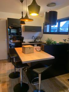 a kitchen with a table with a box on it at LE REFUGE DE LA BAIE in Beaussais sur Mer