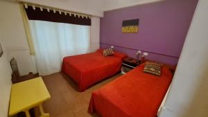 Una cama o camas en una habitación de Hotel del Paseo