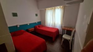 Una cama o camas en una habitación de Hotel del Paseo