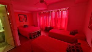 Una cama o camas en una habitación de Hotel del Paseo