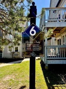 a sign on a pole in front of a house at Mountain Side Studio at The Blue Mountains in Blue Mountains