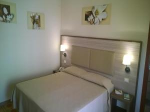 Postel nebo postele na pokoji v ubytování Aparthotel Amelia Dream View