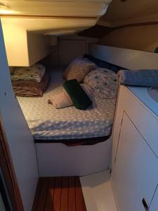 two beds in a small room on a boat at experience on a sailboat to sleep in Barcelona