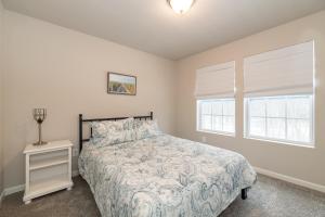 a bedroom with a bed and a window at 'Woodhaven Hideaway' indoor pool, hot tub in South Haven +37 photos