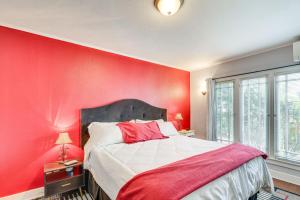 a red bedroom with a bed with a red wall at Classic LA Retreat - 2 Blocks to Melrose Ave! in Los Angeles