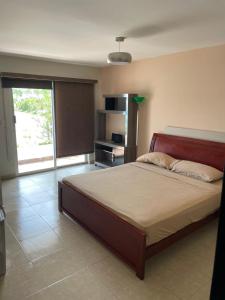 Säng eller sängar i ett rum på Ibiza beach residence Villa