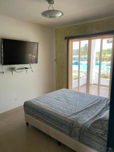 Säng eller sängar i ett rum på Ibiza beach residence Villa