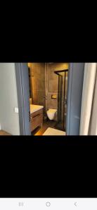 a bathroom with a tub and a toilet and a sink at Başar hotel in Erdemli