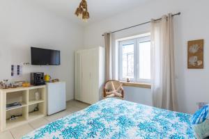 TV a/nebo společenská místnost v ubytování Fortino B&B Capri