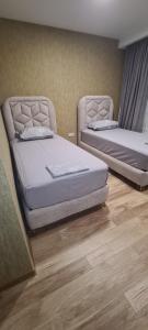 Letto o letti in una camera di KHORGO