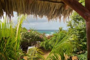a view of the ocean from a thatch hut at Finca Popoyo in Popoyo
