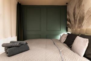 מיטה או מיטות בחדר ב-Asti Gold Apartment