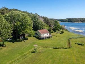 an aerial view of a house on a hill next to the water at 6 person holiday home in STRÖMSTAD-By Traum in Strömstad