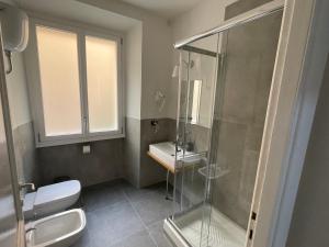 a bathroom with a shower and a toilet and a sink at This must be the place Rome Guesthouse in Rome