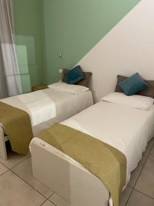 Postel nebo postele na pokoji v ubytování B&B Le Albare